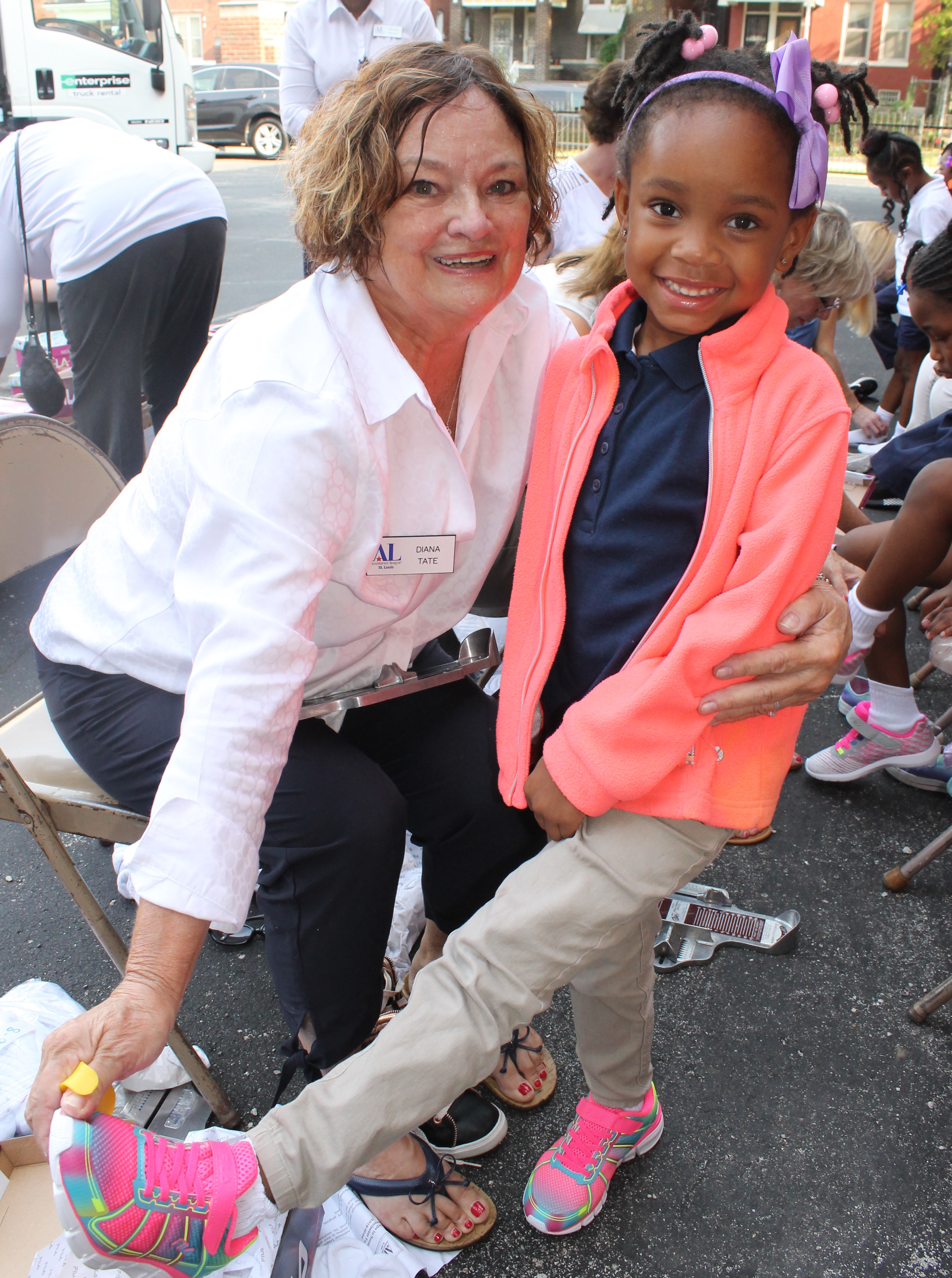 9 10 19 STEPS Diana Tate of Ballwin with Hamilton School kindergartener showing off her shoes